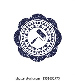 Blue roller brush icon inside rubber seal with grunge texture