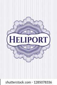 Blue rosette or money style emblem with text Heliport inside