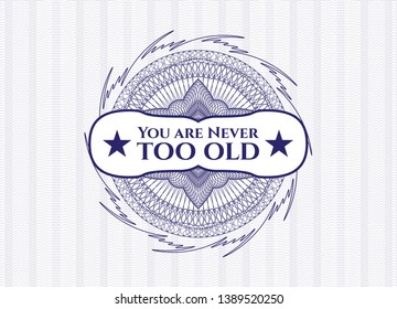 Blue rosette or money style emblem with text You are Never too old inside