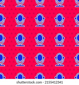 Icono de espejo de maquillaje de redondeo azul aislado a fondo de color rojo.  Vector