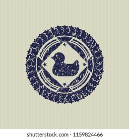 Blue rubber duck icon inside rubber stamp with grunge texture