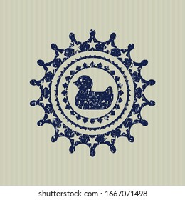 Blue rubber duck icon inside rubber seal with grunge texture