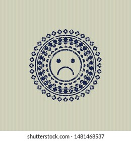 Blue sad face icon inside rubber seal