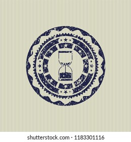 Blue sand clock icon inside distressed rubber seal