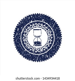 Blue sand clock icon inside rubber stamp with grunge texture