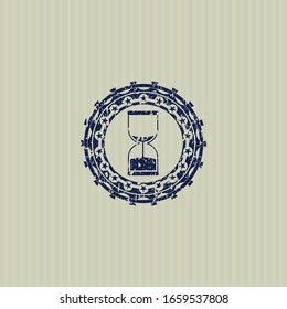 Icono de reloj de arena azul dentro de un sello de grunge angustiado