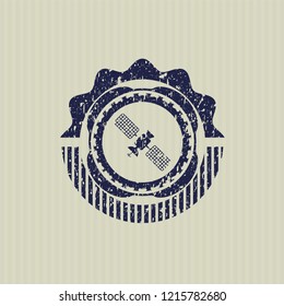 Blue satelite icon inside distressed rubber seal with grunge texture