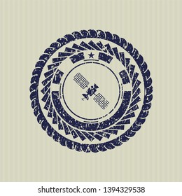 Blue satelite icon inside rubber texture