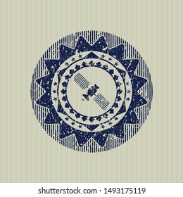 Blue satelite icon inside rubber seal with grunge texture