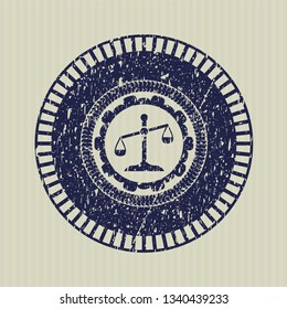 Blue scale icon inside distress with rubber seal texture