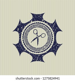 Blue scissors icon inside distress rubber stamp with grunge texture