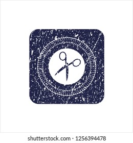 Blue scissors icon inside distressed rubber grunge stamp