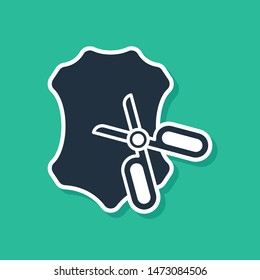 Blue Scissors and leather icon isolated on green background. Tailor symbol. Cutting tool sign.  Vector Illustration