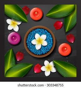 Blue sea salt. spa background. spa background with tropical flowers and stone spa candle. Summer tropical green leaves