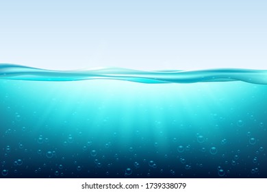 Blue sea wave water surface, fresh ocean underwater.  under surface sea, clean natural view bottom pool with sun rays. 