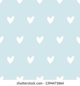 Blue seamless pattern baby boy design. Cute kids soft colored wallpaper. Hand drawn heart on blue background. Graphic baby shower template with tender minimalistic love element. Vector illustration.