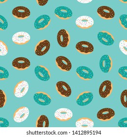 Blue seamless pattern with glazed donuts