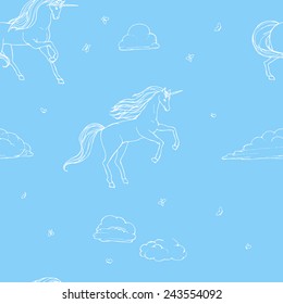 Blue seamless pattern with hand drawn unicorns.