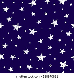 Blue seamless pattern with hand drawn white stars.