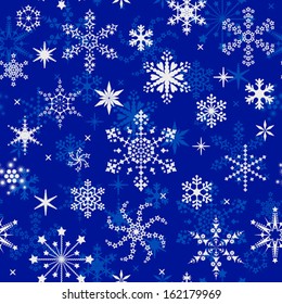 Blue seamless pattern with miscellaneous snowflakes for christmas design.