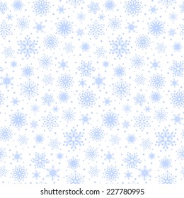 Blue seamless pattern of snowflakes on a white background