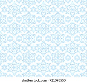 blue seamless pattern of snowflakes on a white background