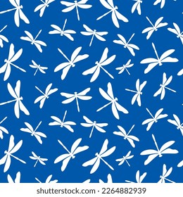 Blue seamless pattern with white dragonfly