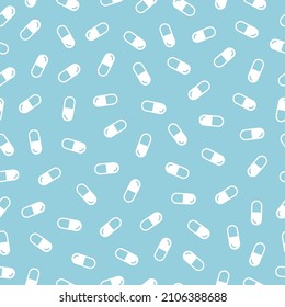 Blue seamless pattern with white pills.