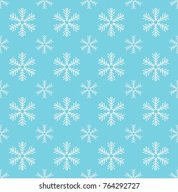 Blue seamless snowflake pattern. Christmas vector background. White snowflakes on a blue background. Pattern swatches included in eps-file, for your convenient use
