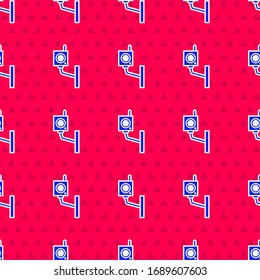 Blue Security camera icon isolated seamless pattern on red background.  Vector Illustration