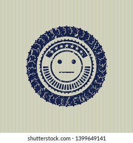 Blue serious face icon inside rubber grunge seal