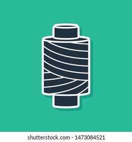 Blue Sewing thread on spool icon isolated on green background. Yarn spool. Thread bobbin.  Vector Illustration