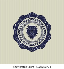Blue shield icon inside distress rubber texture