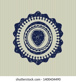Blue shield icon inside distress rubber grunge texture seal