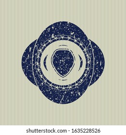 Blue shield icon inside distressed with rubber seal texture
