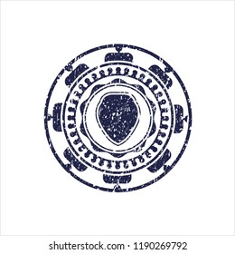 Blue shield icon inside grunge style stamp