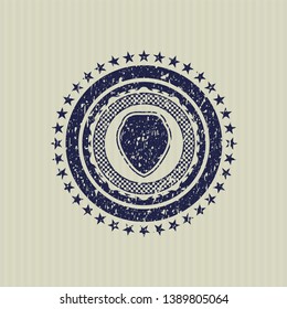 Blue shield icon inside rubber grunge stamp