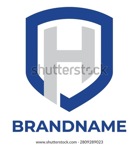 Blue shield logo with gray letter brand identity symbol icon