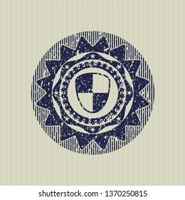 Blue shield, safety icon inside rubber texture