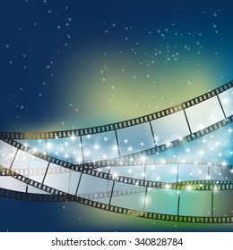 blue shining celebration background with flowing stars and light and filmstrip