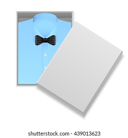 Blue Shirt And Bow Tie In Box On A White Background.