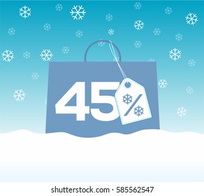 Blue shopping bag with 45% text and a snowflake percent design price tag label on it on snow background. For winter sale campaigns.