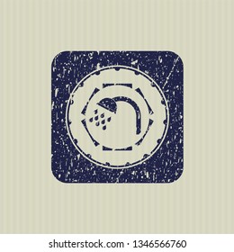 Blue shower icon inside distressed rubber grunge stamp