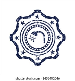 Blue shower icon inside rubber stamp with grunge texture