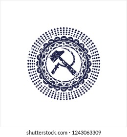 Blue sickle and hammer icon inside rubber seal with grunge texture