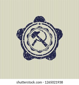 Blue sickle and hammer icon inside rubber stamp with grunge texture