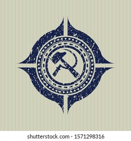 Blue sickle and hammer icon inside distressed rubber grunge texture stamp