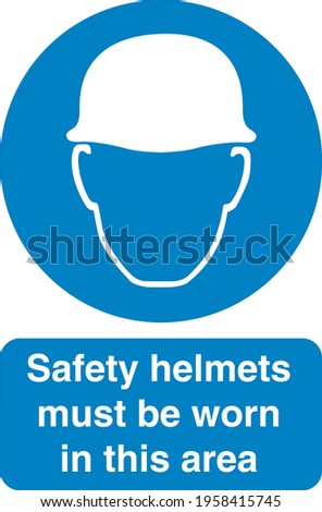 Blue sign board Safety helmets must be worn in this area