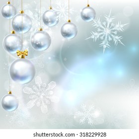 A blue silver abstract snowflakes snow flakes Christmas bauble decoration ornaments festive winter design background.