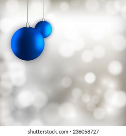 Blue simple christmas balls on the silver abstract background.